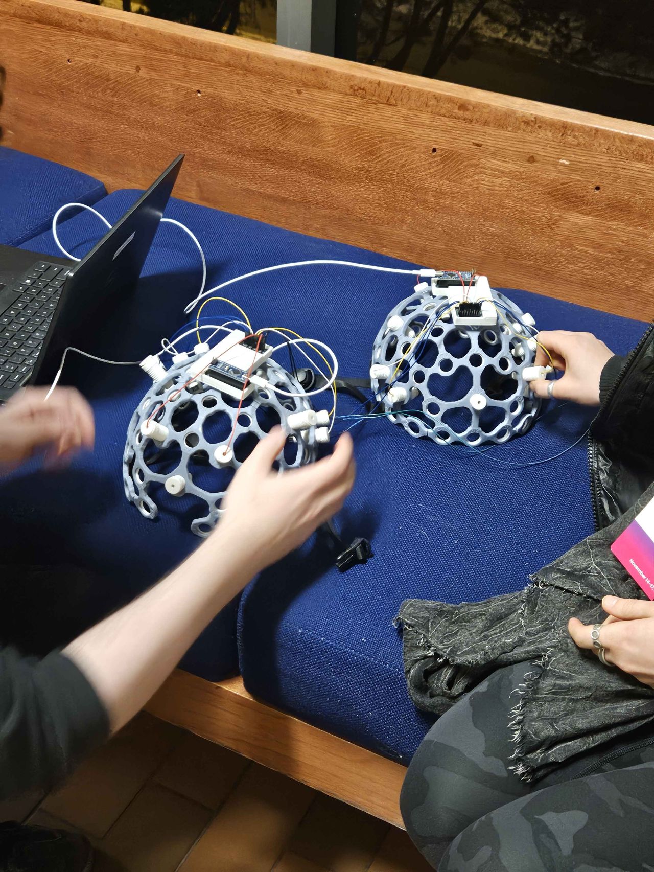 Two participants wearing NeuroPawn Biopotential Kits for the WaveLink demo